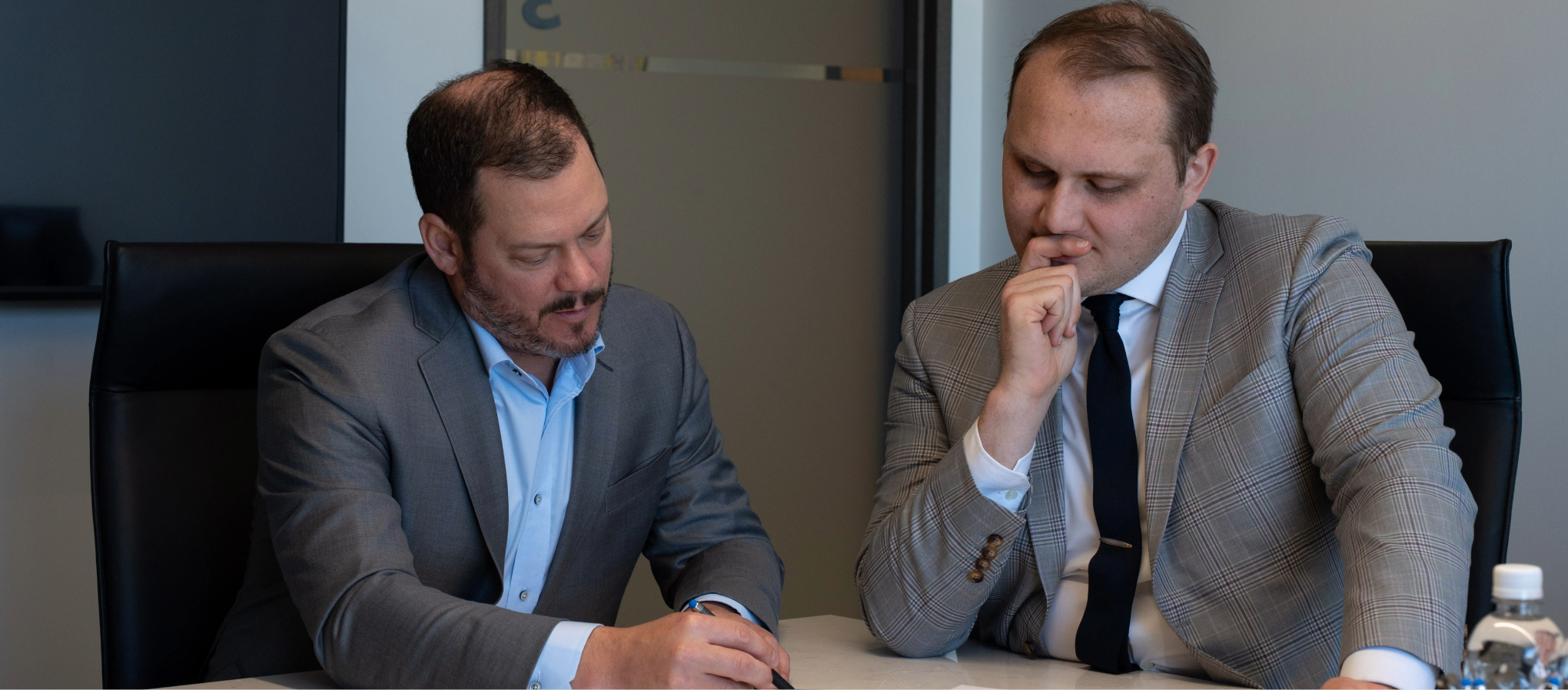 Lawyers reviewing transaction documents with a client