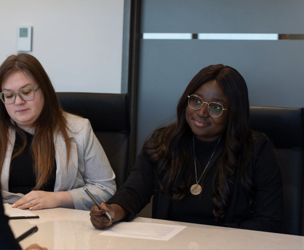 Lawyers meeting with a client to review insurance claim