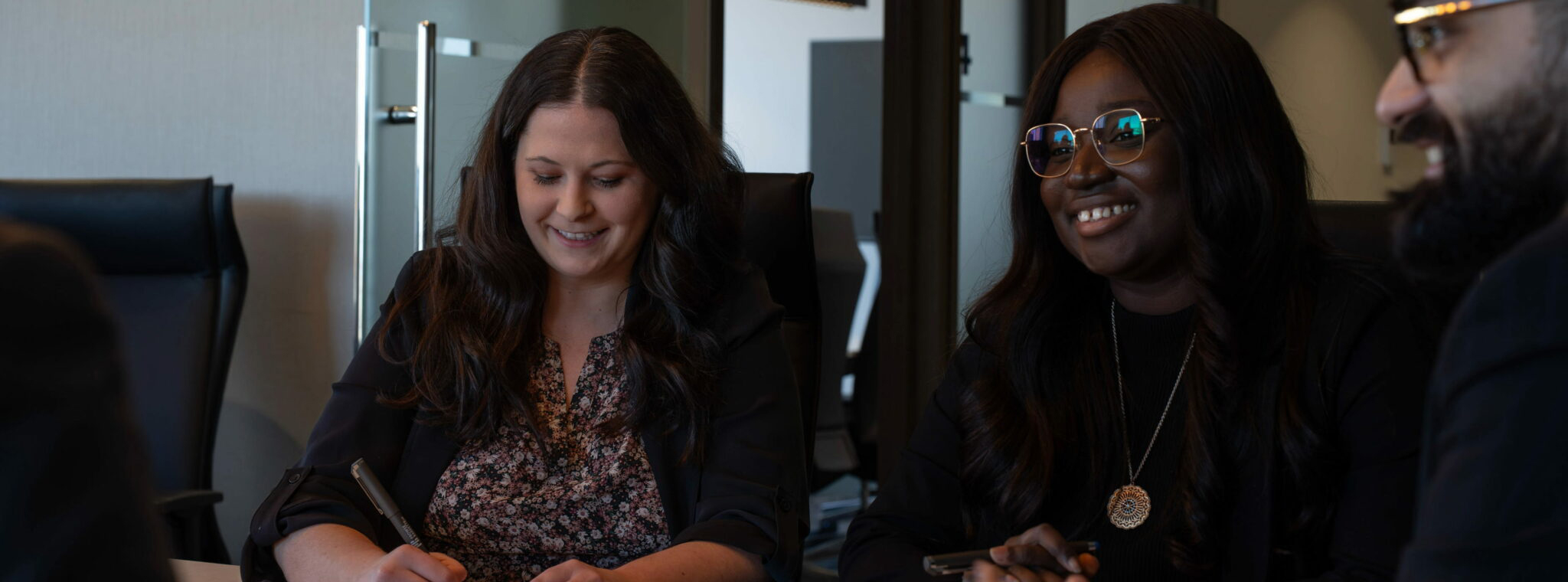 Legal team meeting with clients around a conference table