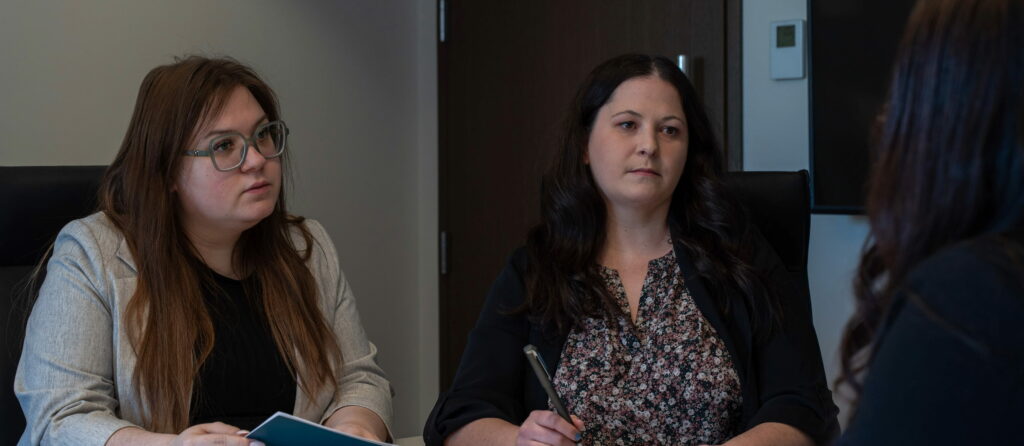 Lawyers advising clients during a contract dispute meeting